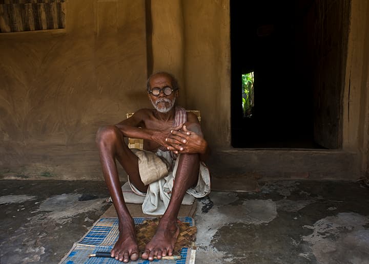 Elderly villager at his doorway