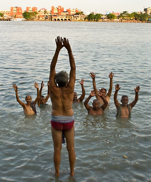 Ritual river exercise at a Kolkata ghat